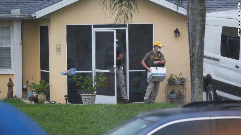 FBI agents remove possible evidence Tuesday from the family home of Brian Laundrie in North Port, Florida.